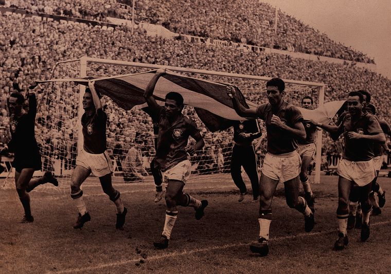 Dominant run: Brazilian players carry their flag after defeating Sweden in the 1958 World Cup final | Getty Images