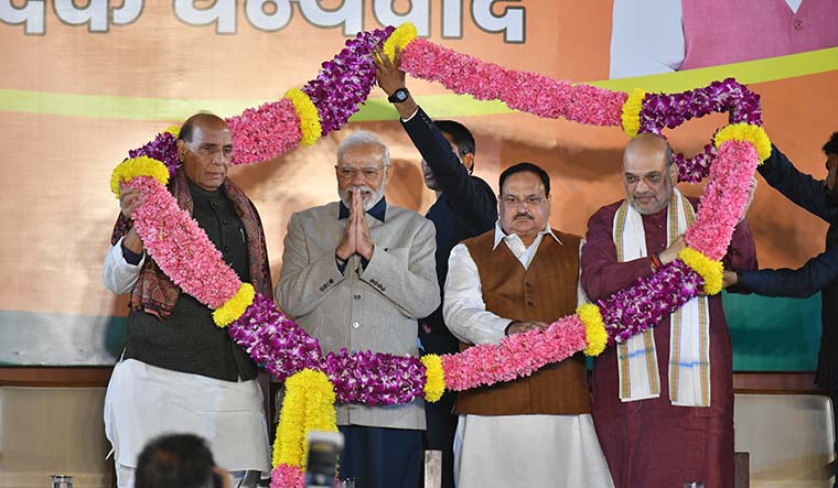 Leading from the front: Prime Minister Narendra Modi, Defence Minister Rajnath Singh, Union Home Minister Amit Shah and BJP president J.P. Nadda at the BJP headquarters celebrating the party’s victory in Gujarat | sanjay Ahlawat