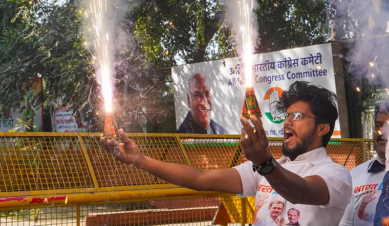 Hill joy: A Congress worker celebrates the party’s win in Himachal Pradesh | PTI