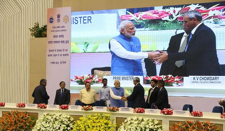 Joint effort: K.V. Chowdary shaking hands with Prime Minister Narendra Modi during a function.