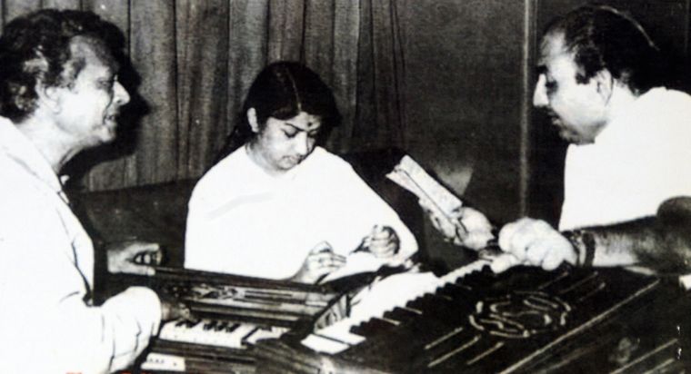 August company: Mohammed Rafi and Lata with music director Noushad.