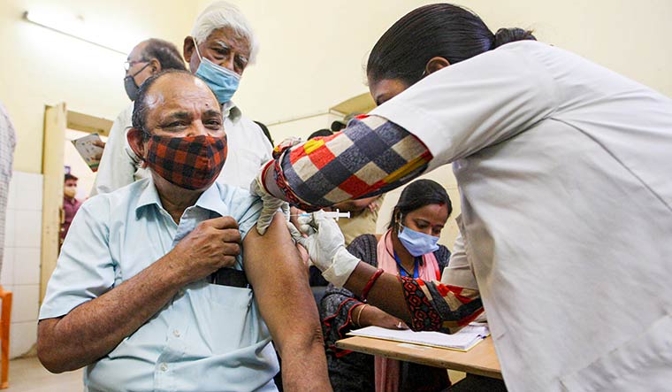 Shield shot: A vaccination drive in Prayagraj | PTI