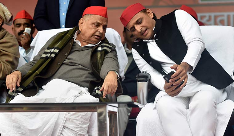 Family matters: Akhilesh Yadav with Mulayam Singh Yadav during a party function in Lucknow | PTI