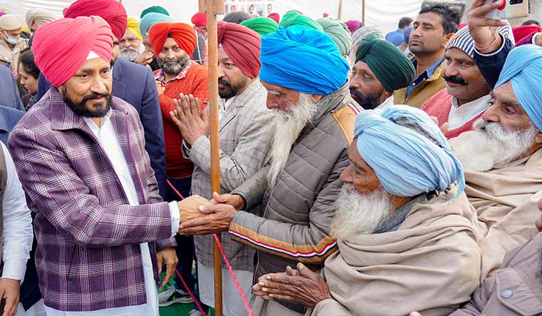 Reaching out: Charanjit Singh Channi meets villagers during a programme to lay down the foundation stone of a bridge on Haripur Nala, at Purkhali village in Ropar district | PTI
