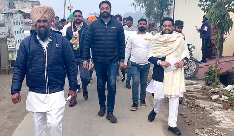 Brazen battle: Sukhpal Singh Khaira’s son, Mehtab (centre), at an election rally.