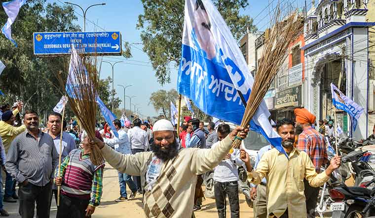New beginning: AAP supporters celebrate the party’s victory in Punjab | PTI