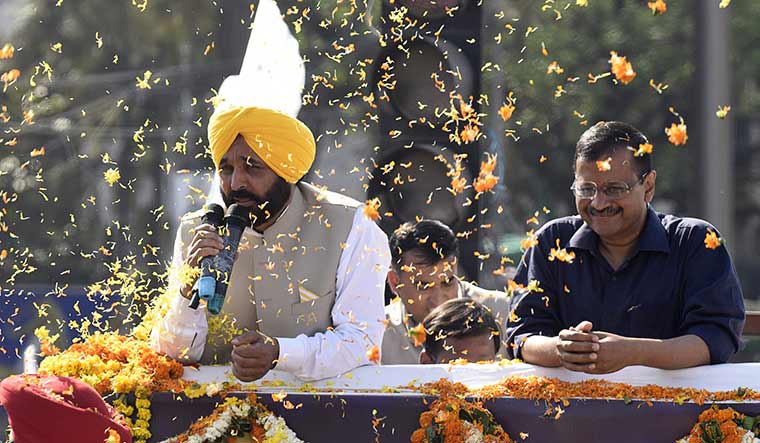 Making inroads: Bhagwant Mann (left) and Arvind Kejriwal after the AAP’s victory in Punjab. The AAP is being factored in with greater seriousness in Gujarat and Himachal Pradesh | AFP