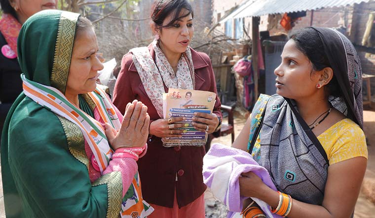 For her: Congress candidate Asha Singh (with folded hands), mother of the Unnao rape victim, while campaigning in a village in Unnao | Pawan Kumar