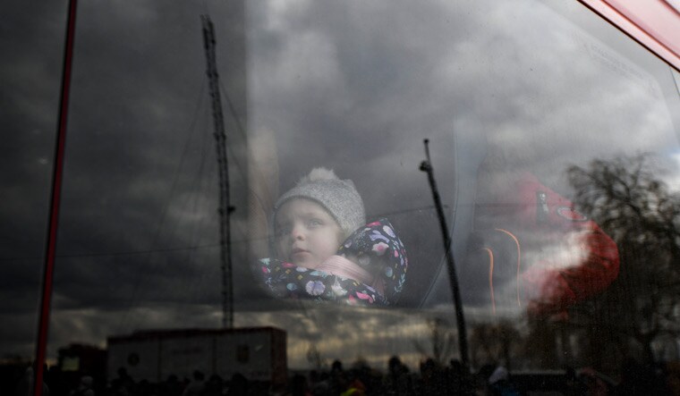 Uncertain future: A young Ukrainian refugee at the country’s border with Romania. More than six  lakh refugees have left Ukraine in the early days of the war | AP