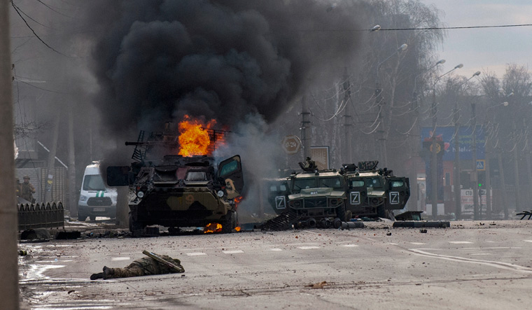 Fire and fury: A Russian armoured personnel carrier burns amid damaged light utility vehicles in Kharkiv in northeastern Ukraine, which has been one of Russia’s key targets in the conflict | AP