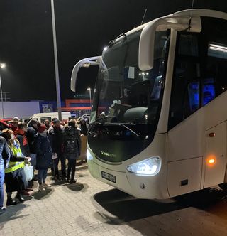Open arms: Volunteers wait to greet refugees coming in packed buses from Ukraine | Pranay Sanklecha 