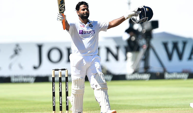 Feather in his cap: Pant celebrates his latest Test century, his fourth, in South Africa this January | Getty Images