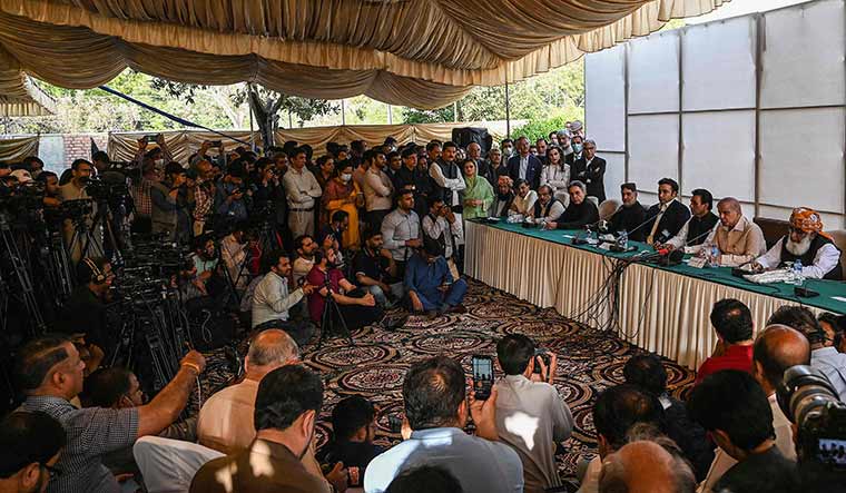 On the offensive: Opposition leaders speak to journalists in Islamabad on March 30 | AFP