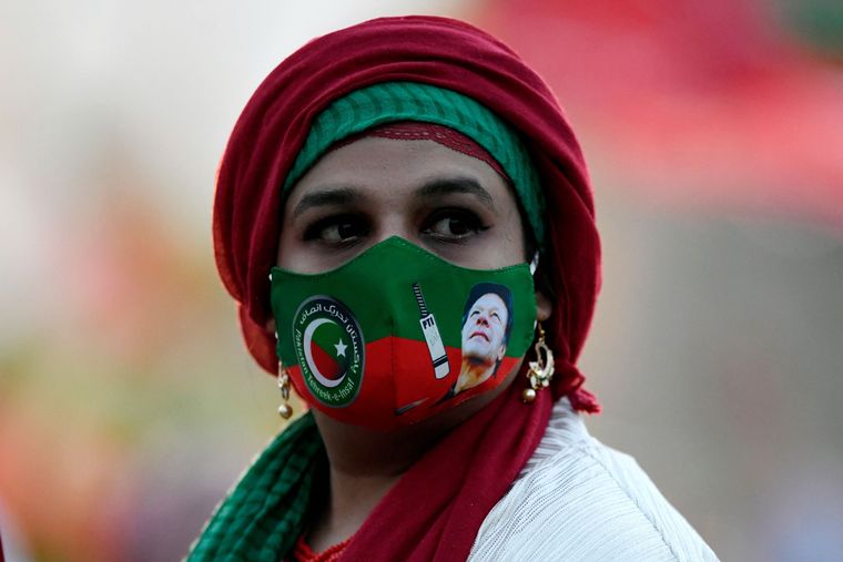 Defiant, determined: An Imran Khan supporter during a rally in Islamabad | AFP