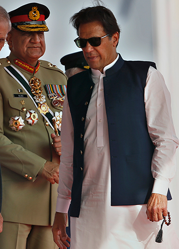 Uneasy ties: Imran Khan with General Bajwa during a military parade in Islamabad on March 23 | AP