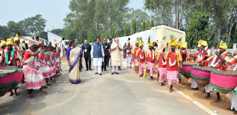 Warm welcome: Prime Minister Narendra Modi being welcomed by tribal dance artists at Khunti, Jharkhand, in the presence of Droupadi Murmu, who served as the state’s governor till July 2021.