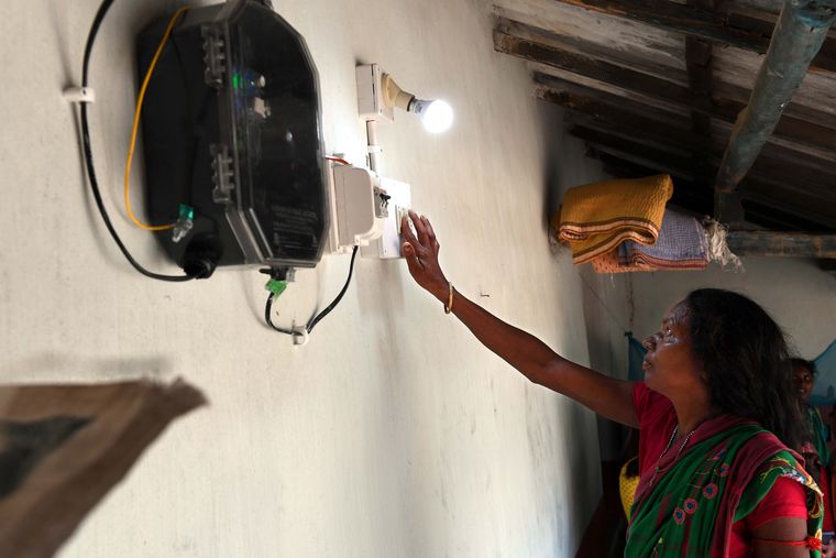 New light, new beginnings: Chudamuni, Murmu’s sister-in-law, tests the new electricity connection to her house | Salil Bera