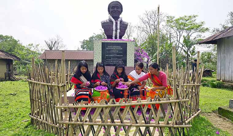 Fond remembrance: Girls at Nungkao village in Manipur offer floral tributes to Rani Gaidinliu’s statue | Salil Bera