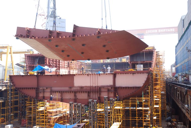 Time flies: A file picture showing employees of Cochin shipyard Building Vikrant; The size and scale of an aircraft carrier being mammoth, the learnings from building Vikrant are immense | Photo Courtesy Cochin Shipyard ltd