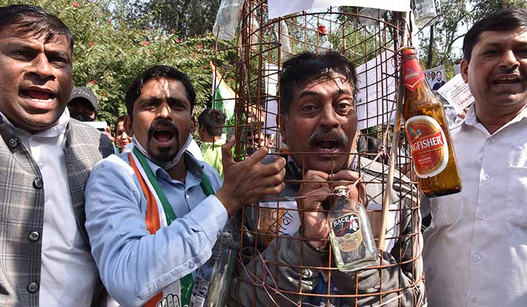 Anger Uncorked: Congress workers protesting the new liquor policy outside Arvind Kejriwal's residence | Getty Images