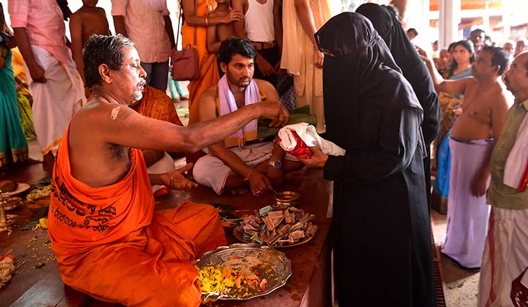 One god, many names: Muslim women at the Kumaramangala temple at Bela in Kasargod, Kerala. They worship Lord Subrahmanya to seek release from kaal sarp yog (curse of the snake) | Jibin Chempola
