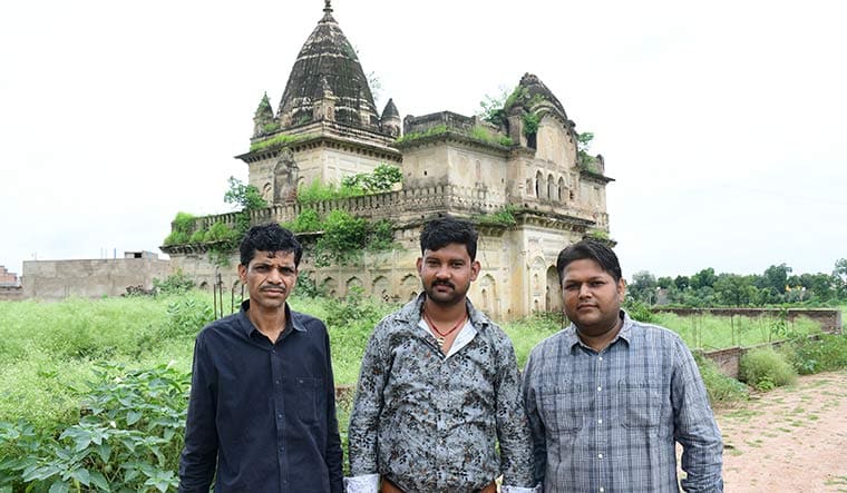 Bonds of brotherhood: (From left) Cousins Farid Khan and Tipu Khan in front of the Krishna temple; also seen Rohit Pathak, office-bearer of the VHP | Aamir Khan