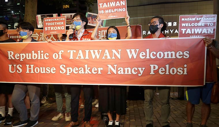 Turbulent trip: Supporters of US House Speaker Nancy Pelosi outside her hotel room during her visit to Taiwan | AP