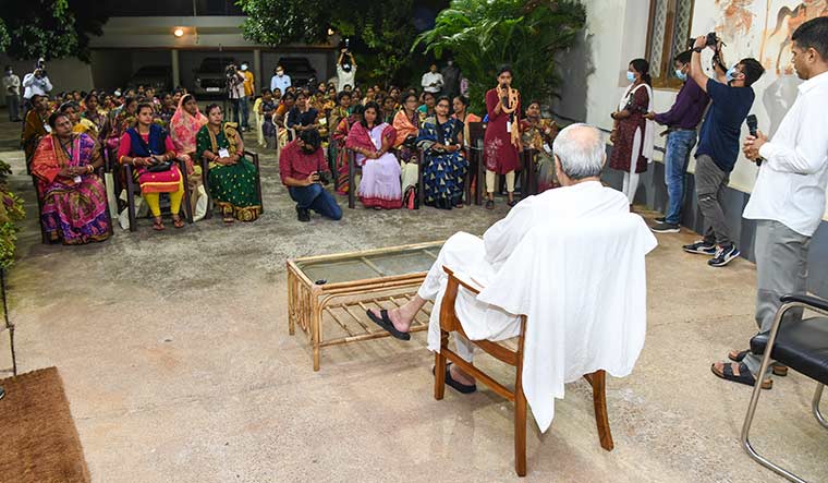 Keen ear: Patnaik with members of self-help groups  at his official residence in Bhubaneswar.