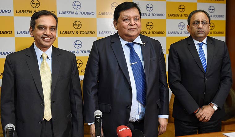 August company: A.M. Naik with L&T’s chief financial officer R. Shankar Raman (left) and chairman and CEO S.N. Subrahmanyan | PTI