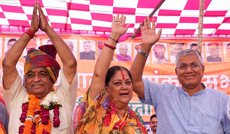 All-weather leader: Former chief minister Vasundhara Raje with Arjun Lal Garg (to her right), BJP candidate from Bilara, and party leader P.P. Chaudhary in Jodhpur. Raje continues to be the BJP's most recognisable face in Rajasthan | PTI