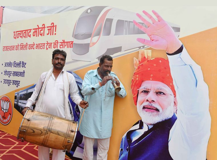 Central pull: BJP supporters in front of Prime Minister Narendra Modi's poster in Jaipur | Sanjay Ahlawat