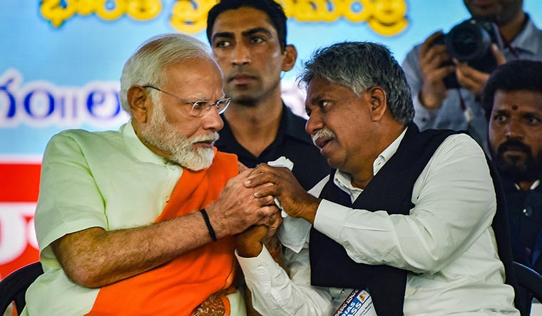 Enemy of my enemy: (Left) Modi with a Madiga leader in Secunderabad | PTI