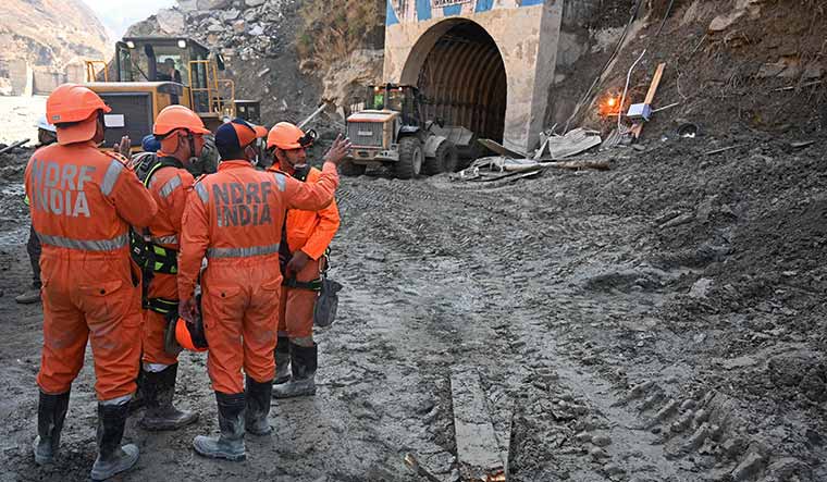 Action stations: National Disaster Response Force personnel prepare for a rescue operation outside a tunnel in Chamoli district on February 10, 2021, after a flash flood | AFP