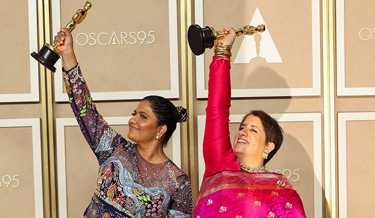 Golden girls: Kartiki Gonsalves (left) with Guneet Monga at the Oscars photo room in Hollywood, Los Angeles | Reuters