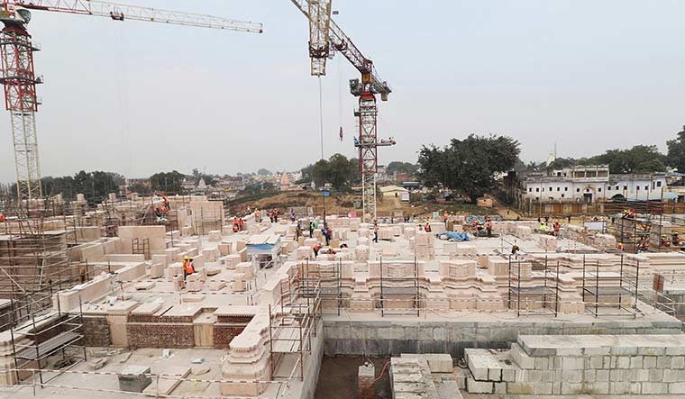 Labourers at work at the Ram Temple construction site in Ayodhya.