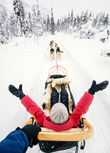 A family on husky safari in Lapland | Shutterstock