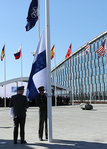 Pole position: Finnish military personnel instal the Finnish national flag at the NATO Headquarters in Brussels, Belgium on April 4, after Finland joined NATO | Getty Images