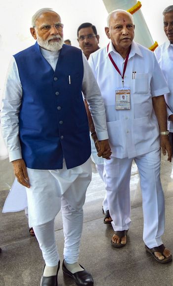 Modi walked hand in hand with Yediyurappa after inaugurating the new airport in Shivamogga. It was a rare spectacle that pointed to Yediyurappa’s relevance in state politics | PTI