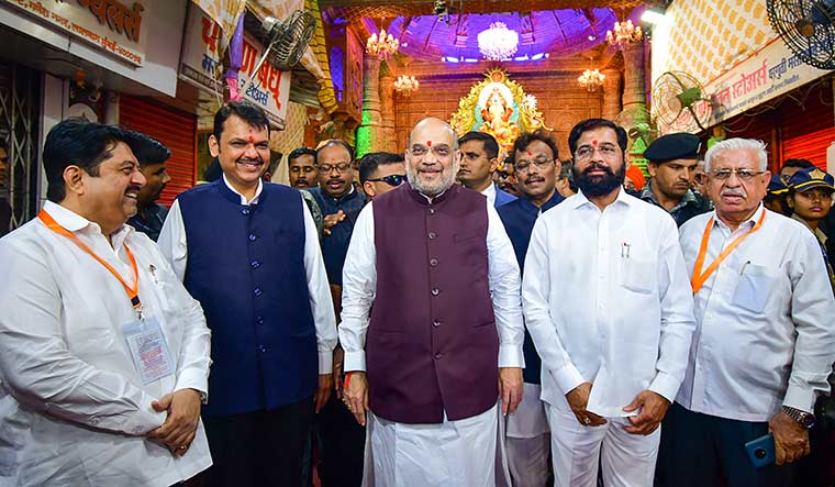 United front: A 2022 photo of Union Home Minister Amit Shah with Eknath Shinde and Deputy Chief Minister Devendra Fadnavis at Lalbaugcha Raja, the prominent Ganesh mandal, in Mumbai | PTI