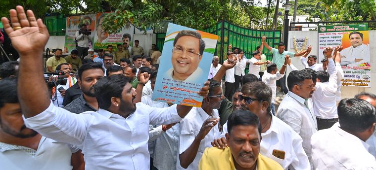 Man of the masses: Siddaramaiah’s supporters celebrate outside his house in Bengaluru after he was named chief minister | Vishnu V. Nair