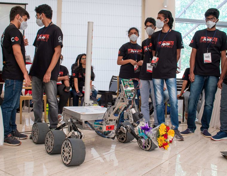 Creative spark: Students at IIT Madras demonstrating a Mars rover they created.