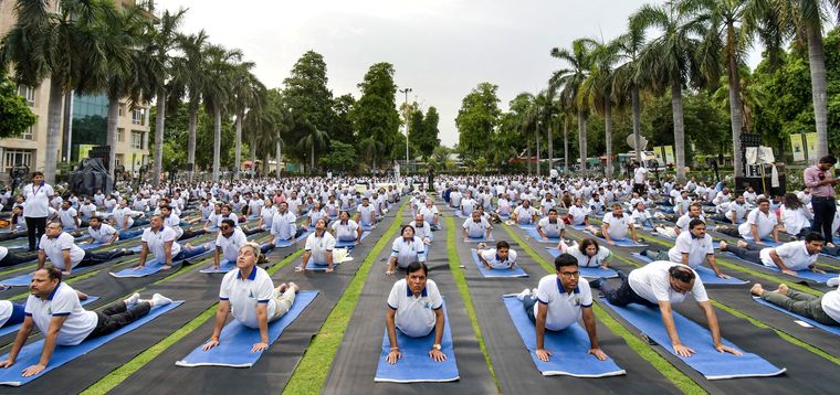 Health is wealth: Union Minister of Health and Family Welfare Mansukh Mandaviya (third from left) leading the International Day of Yoga celebrations at AIIMS, Delhi, on June 21 | PTI