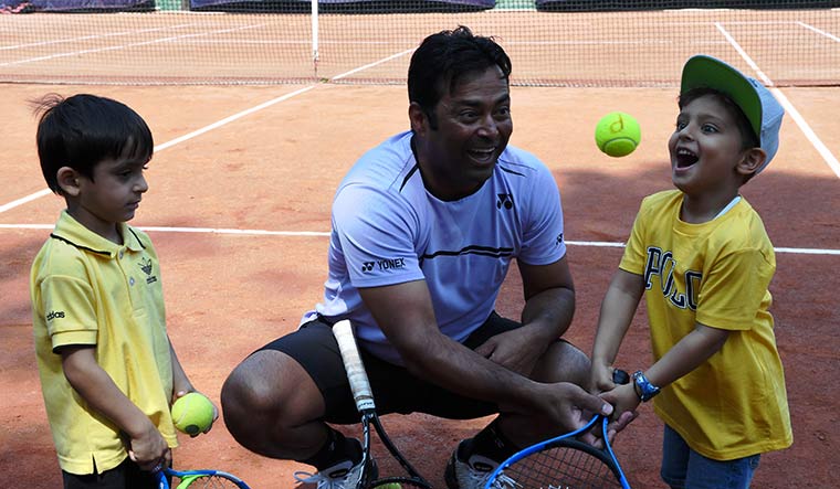 Time to give back: Leander with a young student at a tennis club in Kolkata | Salil Bera
