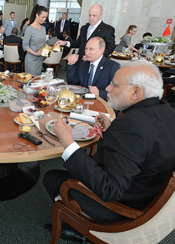 Chief’s chef: Prime Minister Modi and President Putin at a BRICS summit hosted by Russia where they were served by Prigozhin | AP
