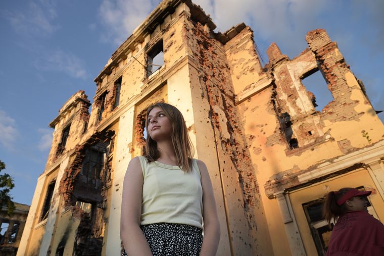 Shell-shocked school: Sophia, 13, from Kharkiv, showing her school damaged in the war. It will take years to rebuild the lost infrastructure.