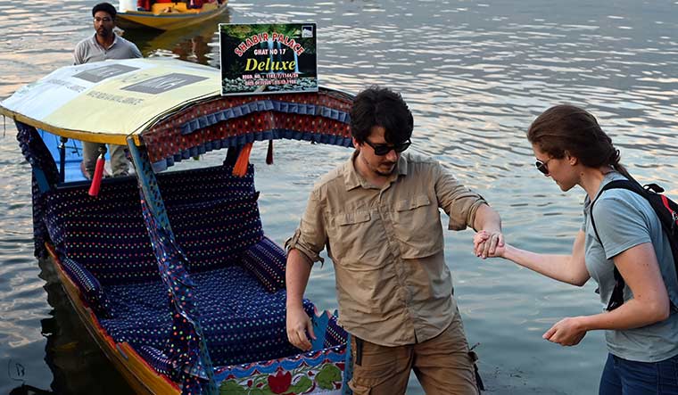 Good times are back: Foreign tourists at Dal Lake.