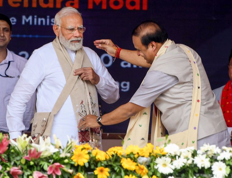 On the right side: Prime Minister Narendra Modi being felicitated by Himanta Biswa Sarma during a 2022 rally at Loringthepi in Karbi Anglong district | PTI