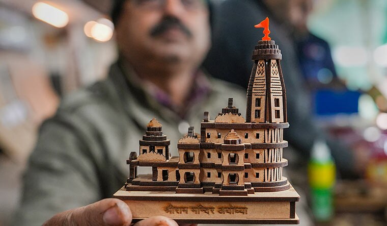 Future in faith: A man with a model of the Ram temple in Ayodhya | PTI