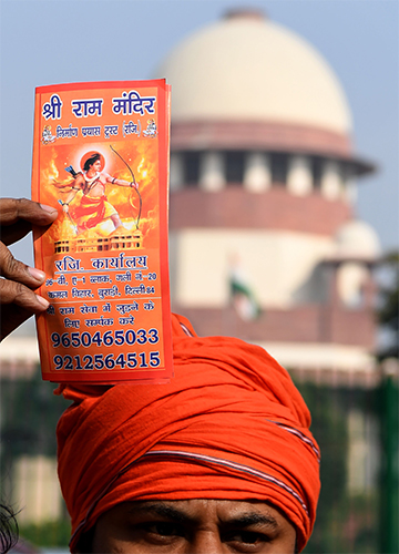 Rendezvous with ram: A Hindu activist holding a leaflet outside the Supreme Court | AFP