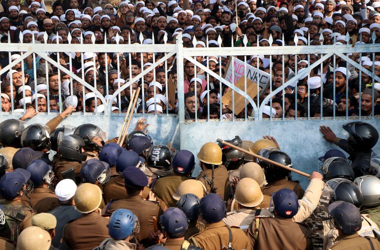 Search for justice: Students of Darul Uloom Nadwatul Ulama, an Islamic university in Lucknow, being stopped by the police during a protest against the Citizenship (Amendment) Act. Chidambaram felt the Act would be struck down by court | Reuters